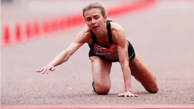 Courageous British Runner Crawls Across 