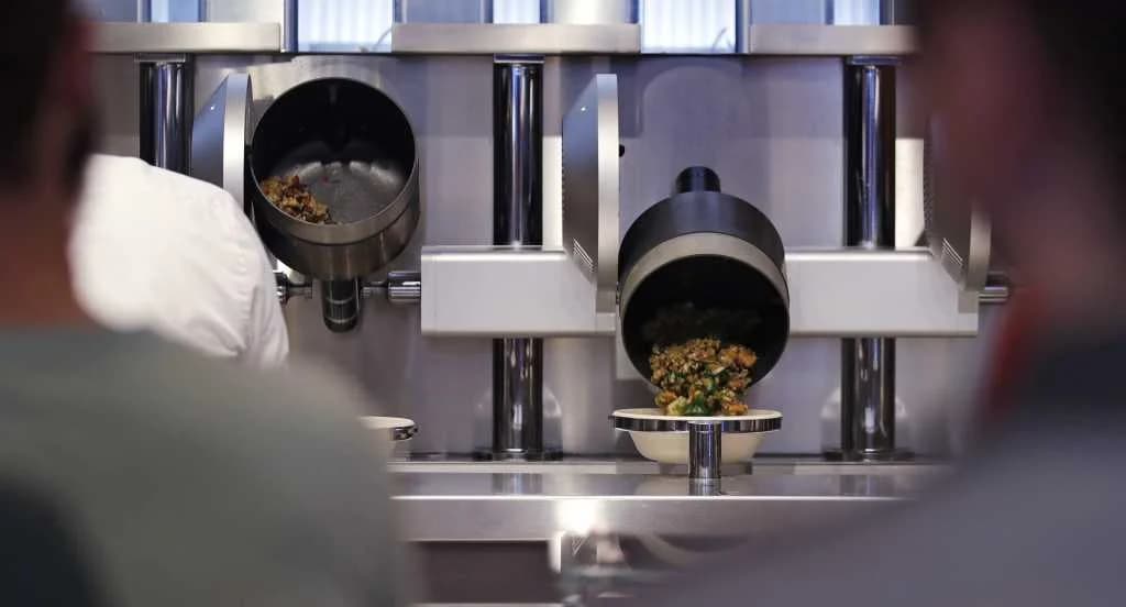 Robotic Woks Serve Food To Customers At 