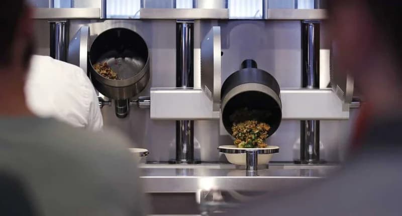 Robotic Woks Serve Food To Customers At 