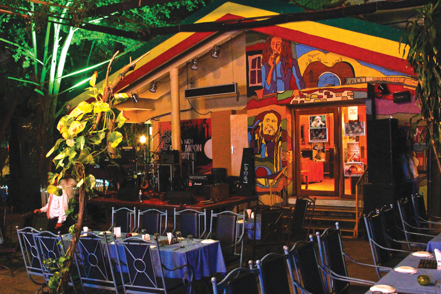 High Spirits Pune- open-air seating & a boho-themed gazebo featuring a stage and RGB wall murals