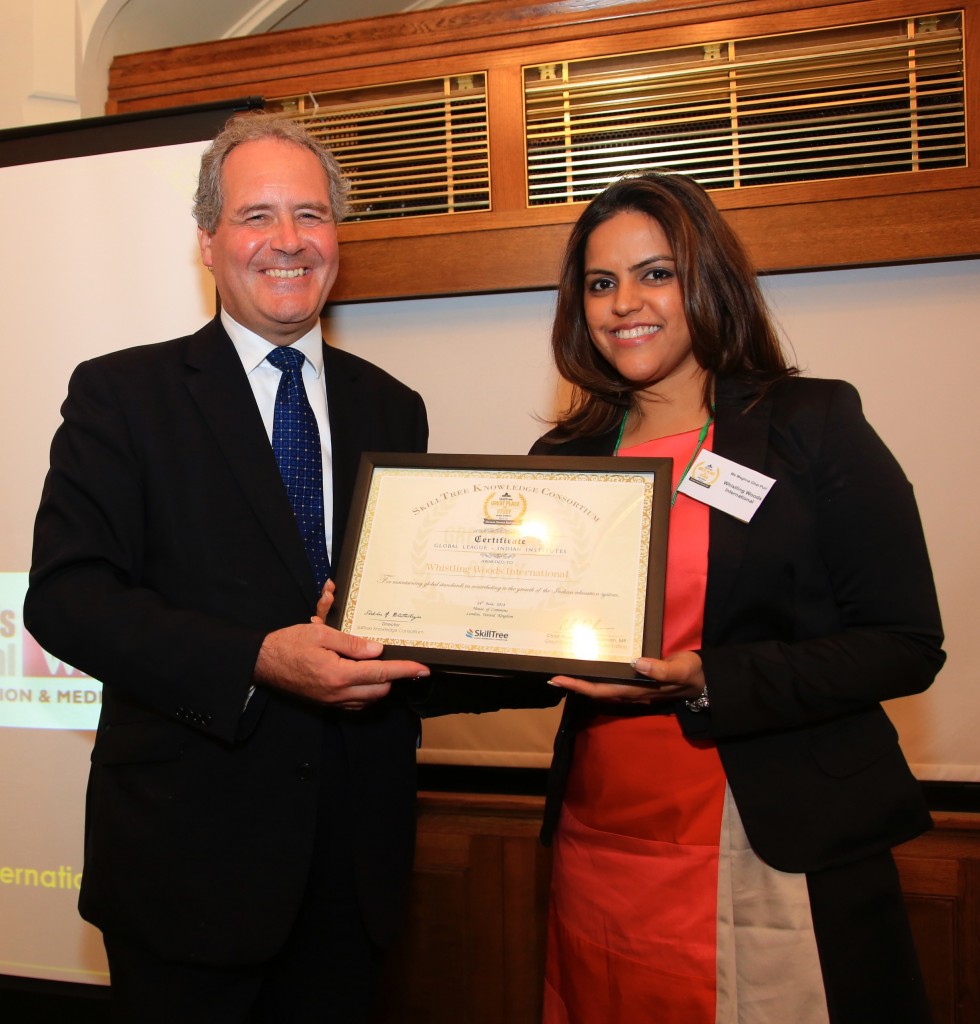 Meghna Ghai Puri recieving award at SkillTree Consortium
